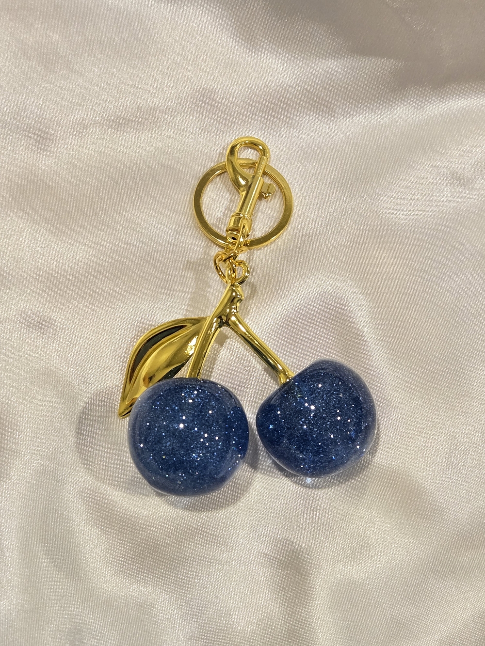Gold-Tone Cherry Keychain with Sparkling Navy Blue Charms - Picture 2 of 3
